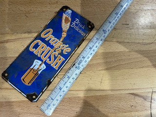 Vintage Drink Delicious Orange Crush porcelain enamel sign, 3 1/2-inch by 8-inch