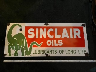 36-inch by 15-inch Sinclair Oils, Lubicants of Long Life, vintage heavy porcelain enamel sign, it weighs about 8 lbs. 