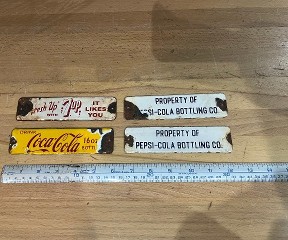 Vintage 1950's soda crate 6 inch porcelain signs, Pepsi Cola, Coca Cola, and 7up.