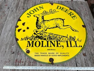 Vintage John Deere Moline Ill. The trade mark of quality made famous by good implements, 29 inch porcelain enamel sign.