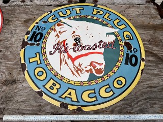 Cut Plug It's Toasted Tabacco, 30 inch diameter porcelain enamel sign.