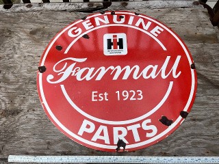 Vintage Genuine Farmal Parts International Harvester Est. 1923, 29 inch diameter porcelain enamel sign.