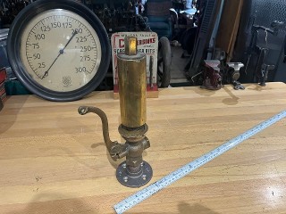 Antique brass steam whistle, 2-inch diameter by 11-inches tall. Antique brass steam whistle, 2-inch diameter by 11-inches tall.