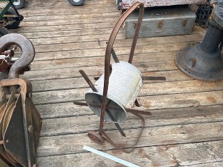 Antique Hose Reel cart with 4 1/2 inch cast iron wheels, measures about 33-inches tall by 14-inches wide.