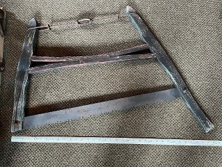 Antique Saint Joseph crosscut bucking saw with 28-inch blade. Antique Saint Joseph crosscut bucking saw with 28-inch blade.