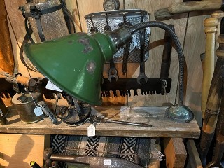 Vintage adjustable bent neck shop light with 8-inch green porcelain enamel shade, screw down base with on-off switch. Vintage adjustable bent neck shop light with 8-inch green porcelain enamel shade, screw down base with on-off switch.