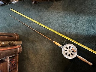 Vintage 67-inches long bamboo trolling rod with S.S. wire on 8-inch banjo reel, used for fishing Lake Trout. Vintage 67-inches long bamboo trolling rod with S.S. wire on 8-inch banjo reel, used for fishing Lake Trout.